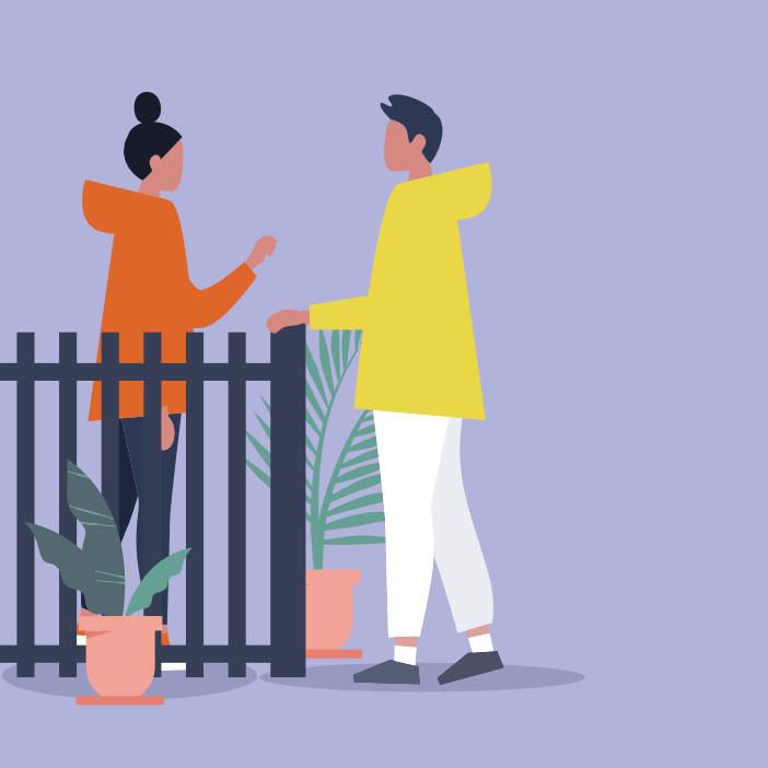 Two neighbours talking over a garden fence